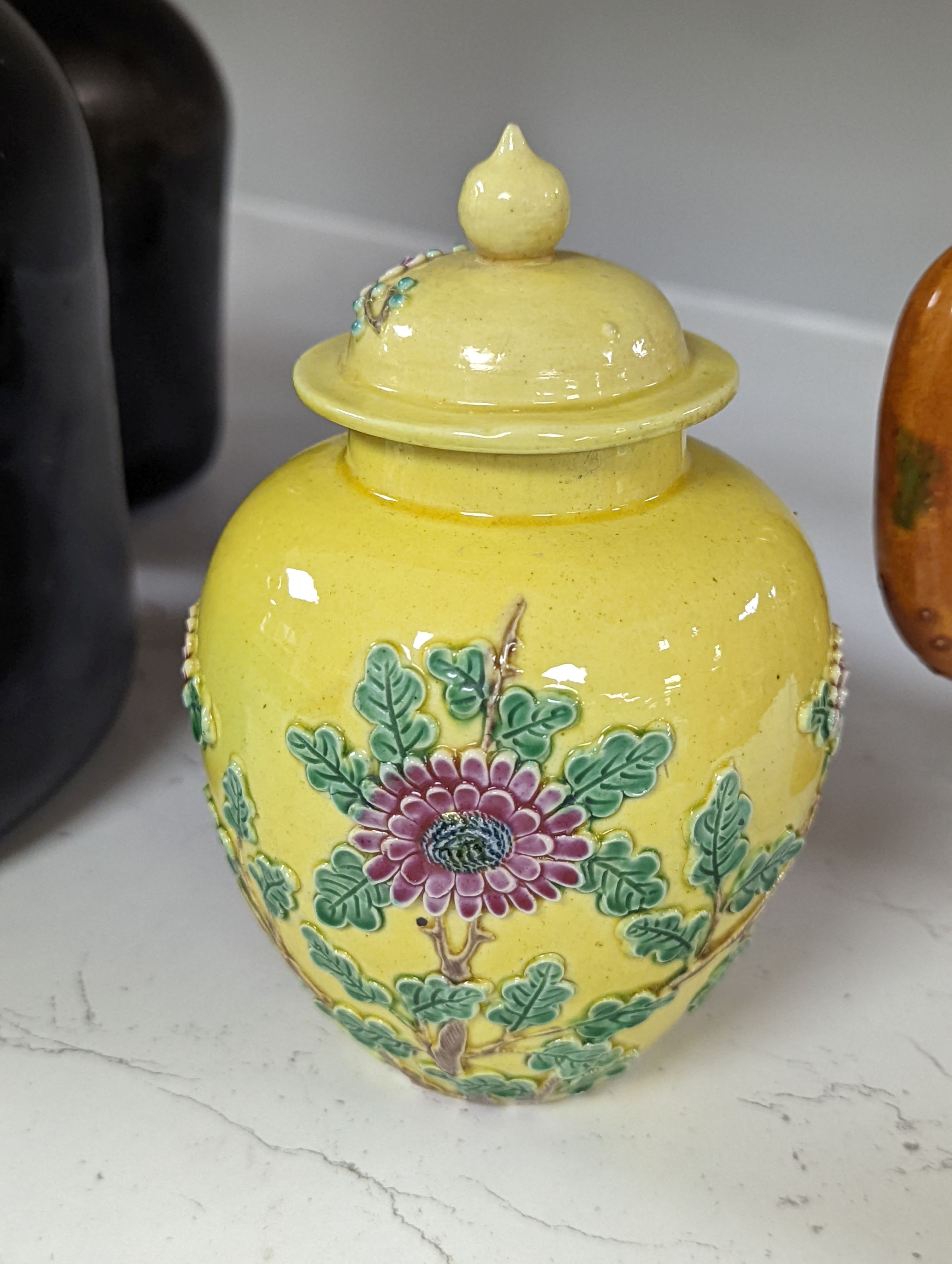 A Chinese enamelled yellow-ground jar and cover, a pottery teapot and cover and a flambe vase, latter 13cm